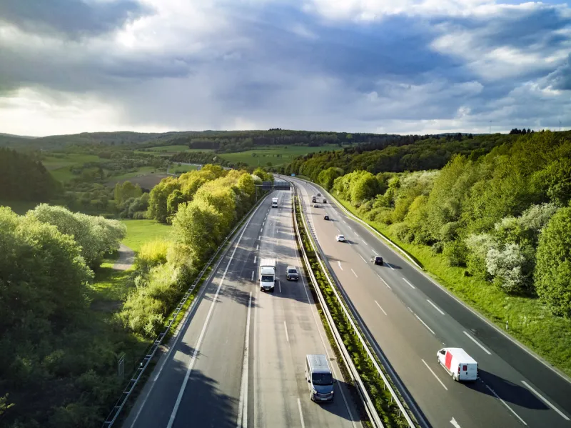 highway in germany with cars and sky with big clouds