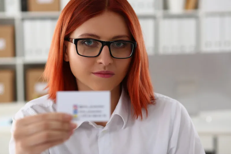 business woman holding a business card closeup ceo exchange partner company name concept