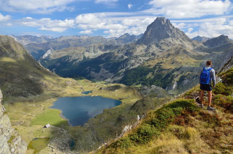there are the alpine lake gentau, the recognizable summit pic du midi d'ossau and remote mountain ranges in the bearn pyrenees