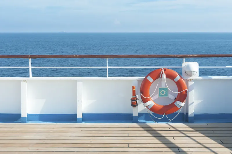 ship deck, buoy and blue ocean travel background