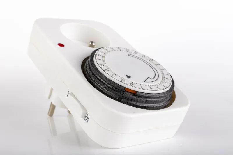 timer for switching on the electric current device for controlling electrical devices light background