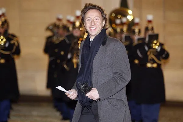 l'hôte de télévision français stéphane bern sourit alors qu'il arrive pour un dîner d'État avec le roi et la reine de suède au palais présidentiel d'elysée à paris le 2 décembre 2014 afp photo matthieu alexandre afp photo matthieu alexandre