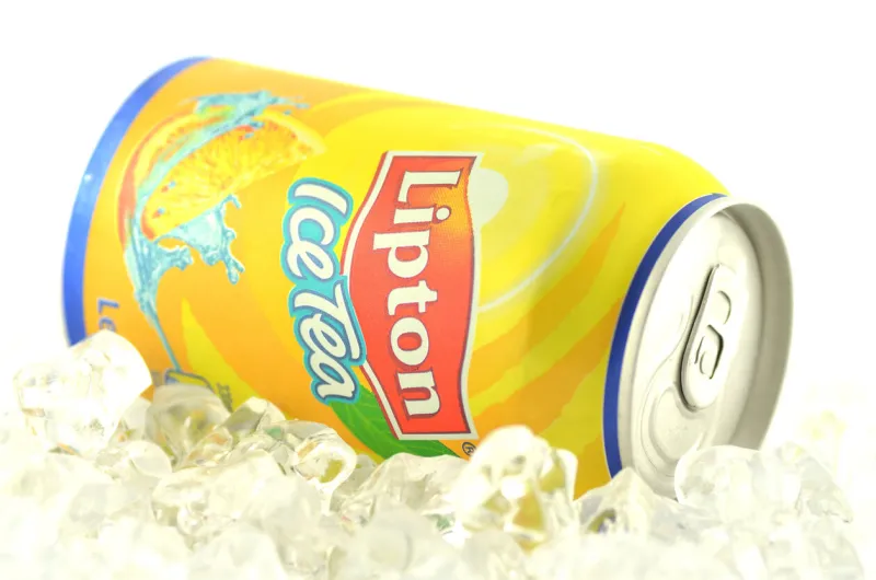 kwidzyn, poland - march 11, 2014  lipton ice tea drink in can on ice isolated on white background lipton ice tea is a brand sold by lipton