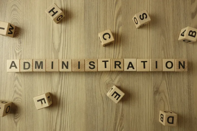 word administration from wooden blocks on desk