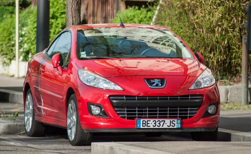 mulhouse - france - 24 aprill 2018 - red peugeot 308 cc parked in the street