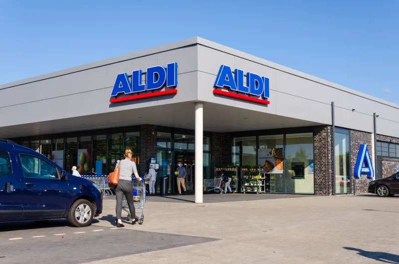 schleswig, germany - september 01, 2021  aldi (stylized as aldi) is the common brand of two german family-owned discount supermarket chains with over 10,000 stores in 20 countries
