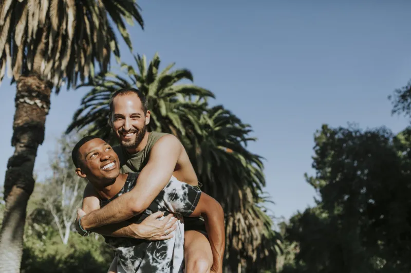 gay couple hugging in the park