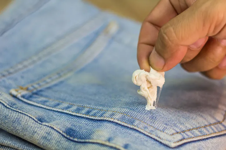 gum sticking on jean with holding hand to remove, this is so bad for morning day