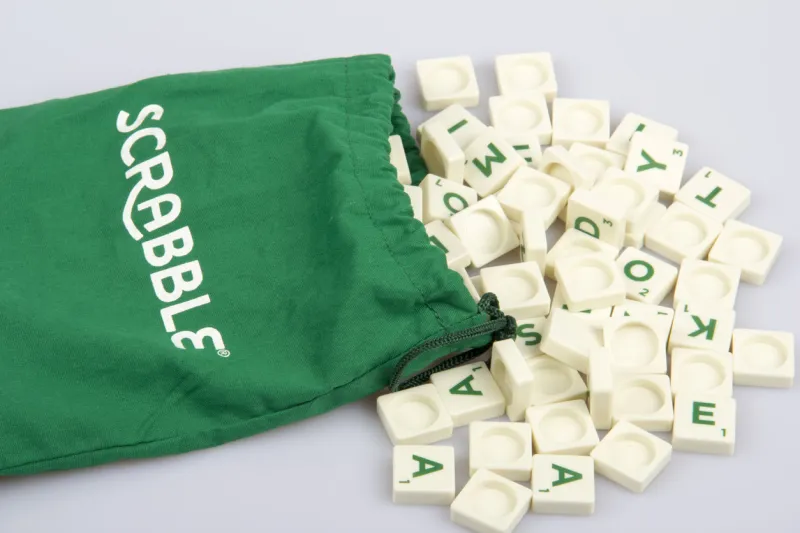 konak,İzmir,turkey- june 15, 2014  scrabble letter tiles scattered from the bag and it's distributed by mattel