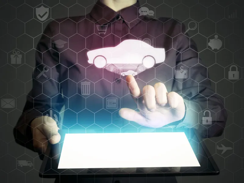 image of a girl with tablet in her hands she looking for a car for buying or for rent, using online searching service