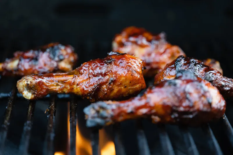 chicken barbequing on a grill