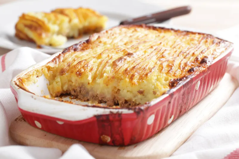 cottage pie in the red stoneware baker