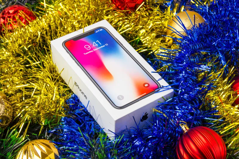 rostov-on-don, russia - december 3, 2017  a box with a smartphone iphone x a popular smarfon on christmas decorations