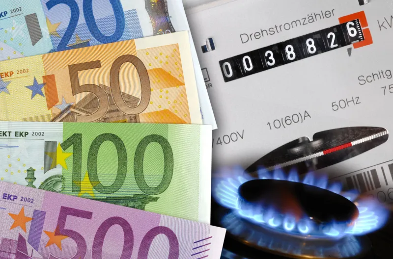 euro cash, gas flame and electric meter as symbol for expensive energy costs