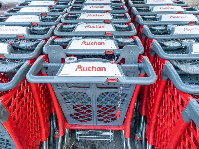 calais, france - january 14, 2020   close-up shopping trolleys auchan hypermarketauchan is a french international supermarket chain, is one of the largest distribution groups in the world
