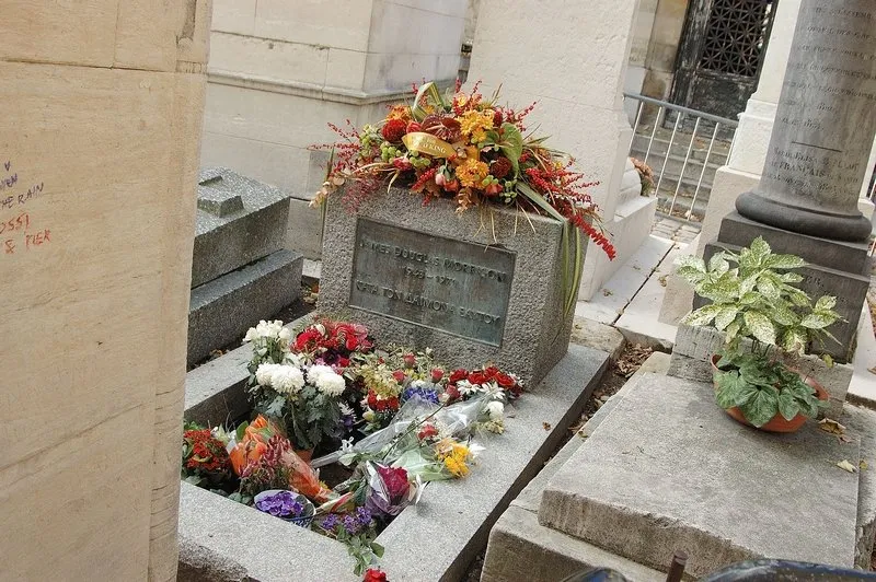 jim morrison's grave at pere lachaise cemetery in paris