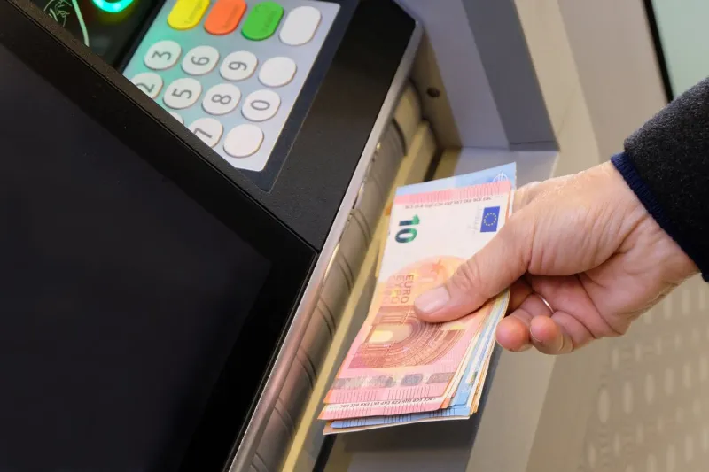 vannes, france, january 7, 2022  withdrawing euro banknotes from a cash machine