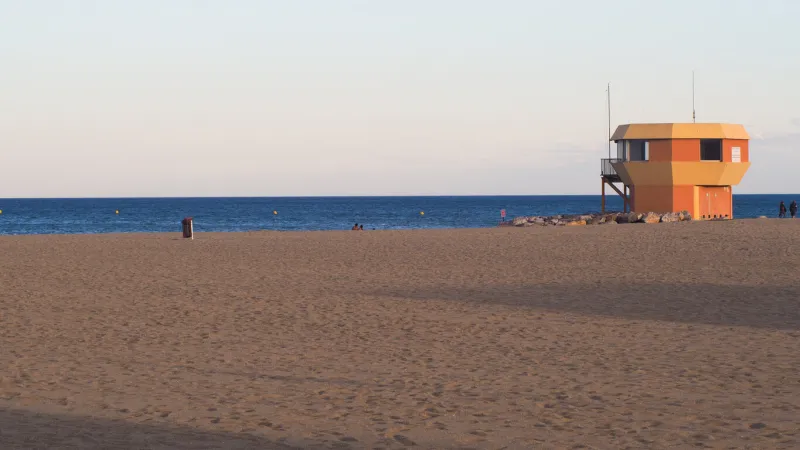 walk to port-leucate beach, during dusk tourists continue to swim at this time