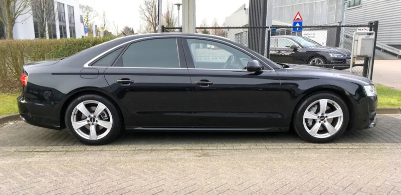 naarden, the netherlands - march 11, 20178 black audi a8 parked by the side of the road nobody in the vehicle