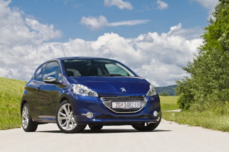 zagreb, croatia - june 5th, 2012  new peugeot 208 parked on a path by the mound of river sava new generation of peugeot bestseller is smaller and lighter than 207 and is a spiritual predecessor of iconic