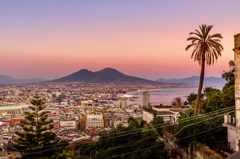 napoli, italy - july 11, 2021  bay of napoli and vesuvius volcano in background at sunset in a summer day in italy, campania