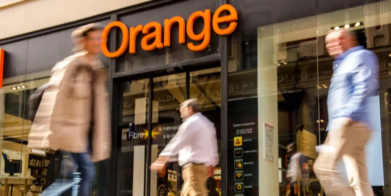 people pass a store for internet and telephone service provider orange on september 23, 2016 in lille (photo by philippe huguen   afp)