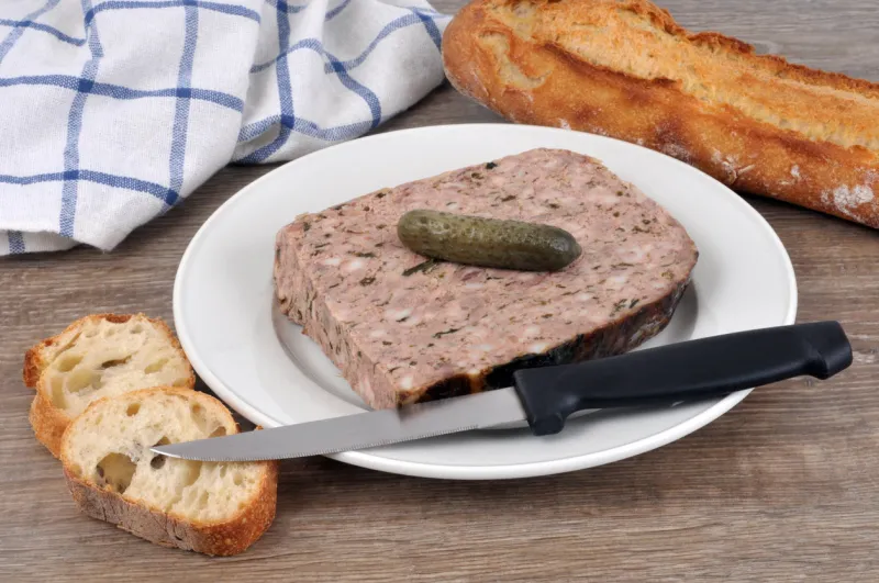 plate of pâté de campagne with a pickle