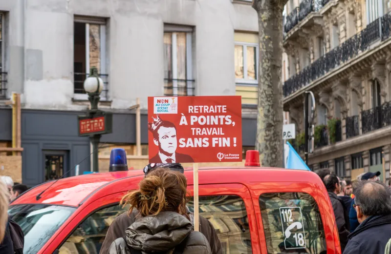paris, france - december 17 2019   protest of the unions against the retirement pension reform of the president macron government - anti macron sign