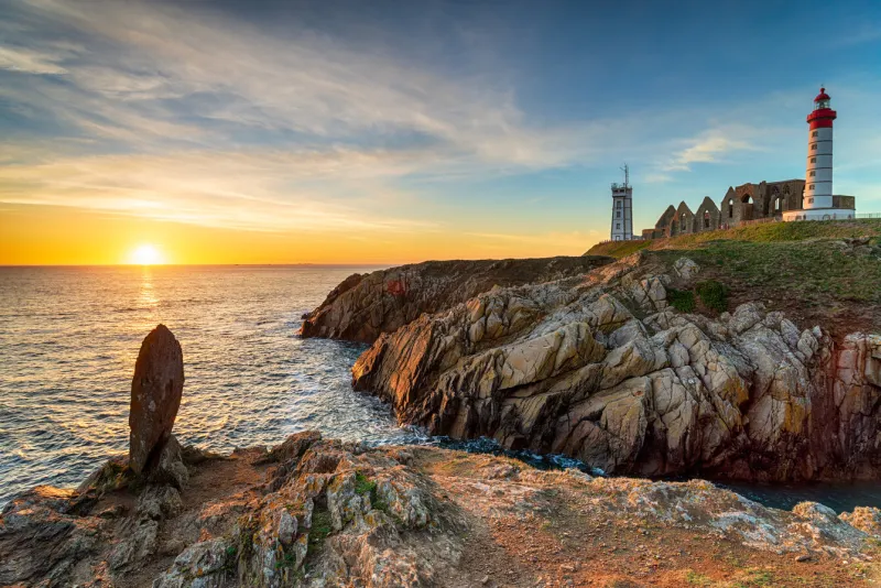 beautiful sunset over the lighthouse at saint mathieu on the bretagne coastline near brest