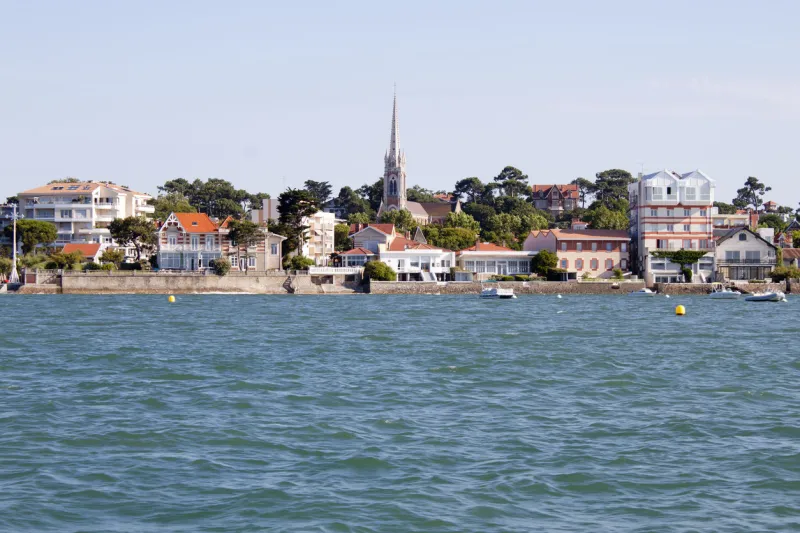arcachon coast from a boat seeing the notre dame basilique, france