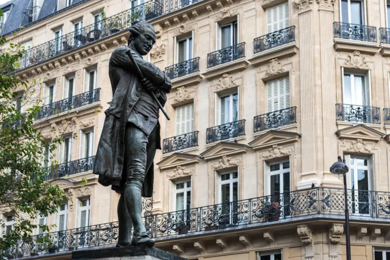 paris, france - october 23, 2014  statue of pierre-augustin caron de beaumarchais by louis clausade (1895), in the 4th arrondissement of paris