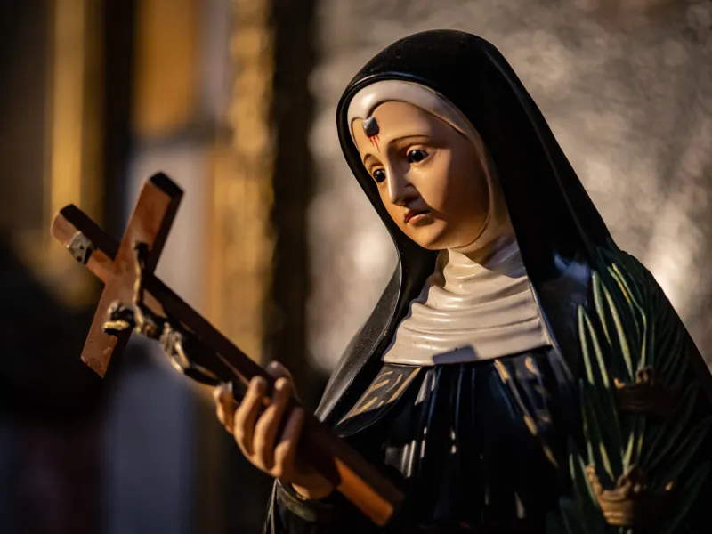 albi cathedral, france, january 21, 2020  a nun holding a crusifix with blood coming out of her forehead