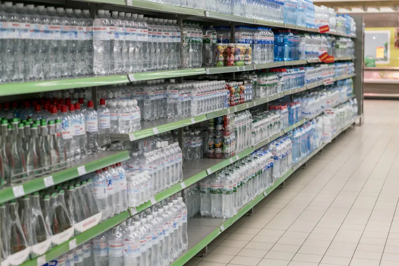 kiev, ukraine february 1 2018 various choice of plastic mineral water bottles display on the supermarket shelves