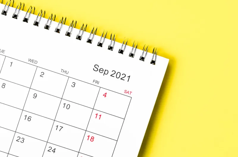 close up september 2021 calendar desk for organizer to plan and reminder on yellow background