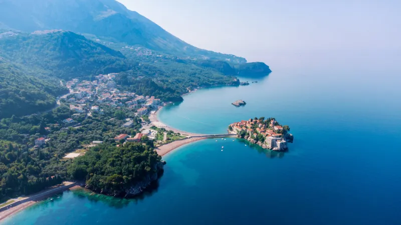view from flying drone panoramic view of sveti stefan island in a beautiful summer day, montenegrotop view beautiful destinations