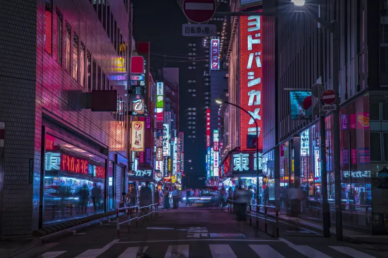 a night of the neon street at the downtown wide shot shinjuku district tokyo   japan - 08292019 it is a famous town in shinjuku it's called shibuya crossing we can see many people & neon billboard