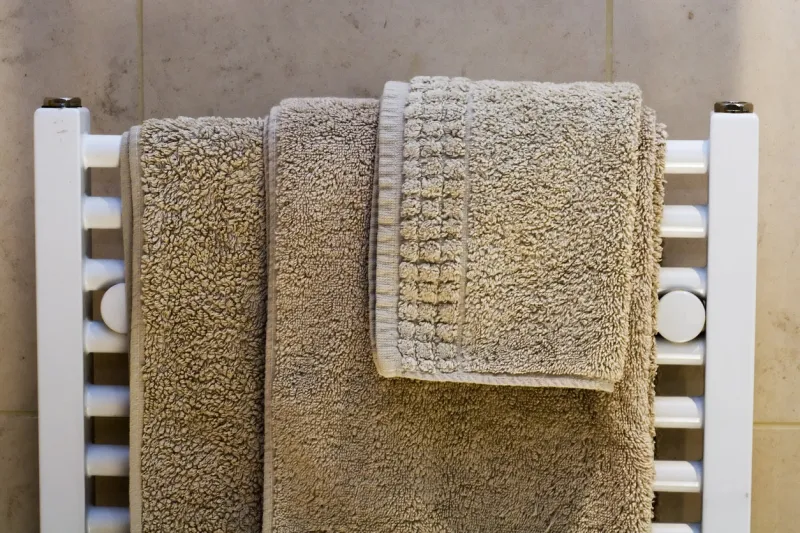 hotel style towels on radiator rack