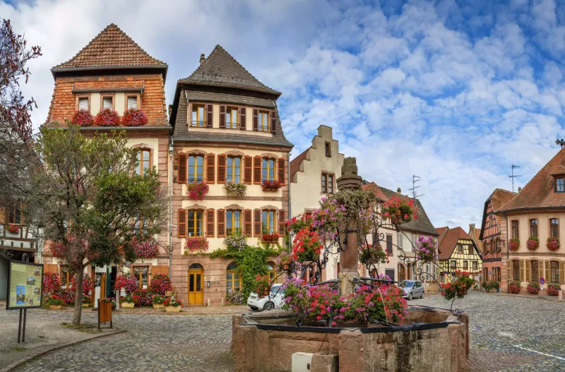 square with fountain in bergheim, alsace, france