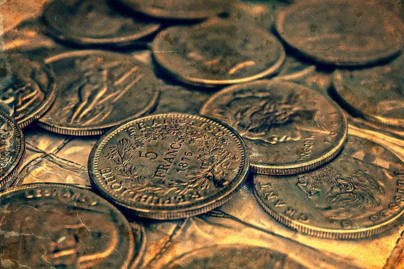 old coins of different nationalities, from different periods image digitally manipulated as one old photo