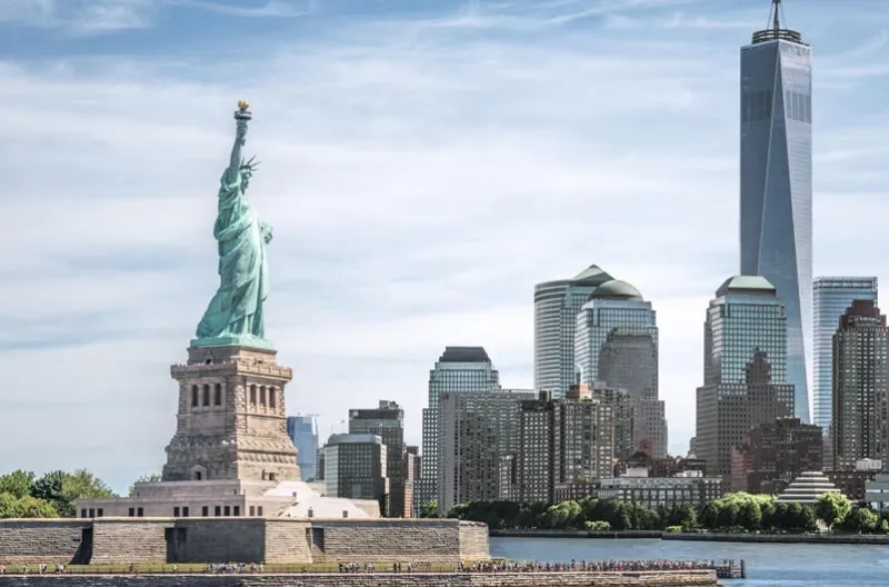 the statue of liberty with one world trade center background, landmarks of new york city, usa
