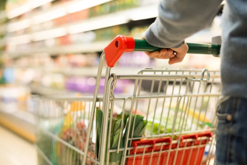 close-up detail of a man shopping in a supermarket