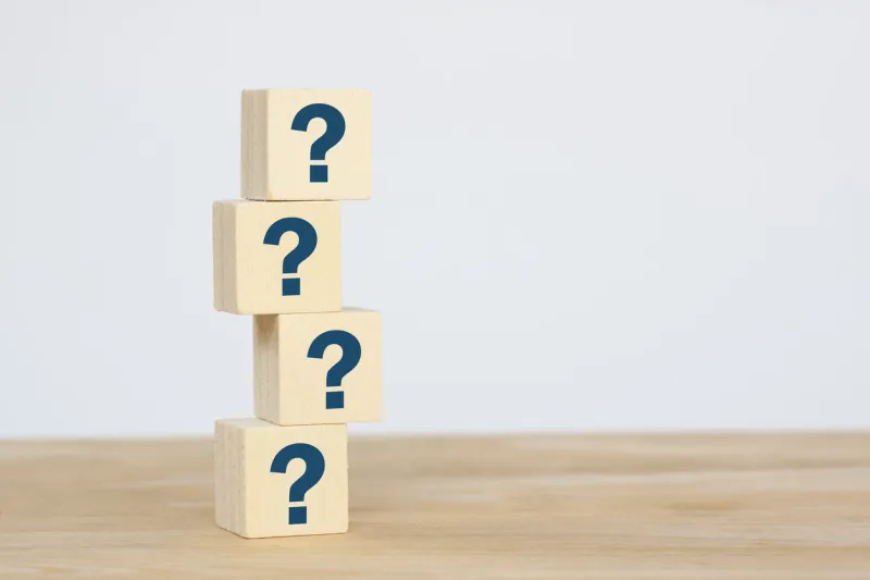 group of wooden cube block on table, thinking different, way how to find answer, copy space for text on grey background