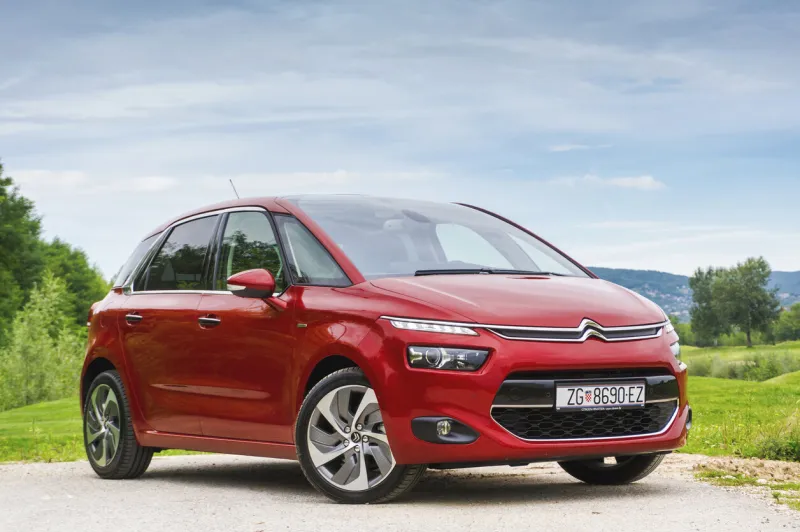 zagreb, croatia - september 2, 2013  new citroen c4 picasso parked next to cultured lawn new generation of french multi purpose vehicle brings radical, futuristic design and lots of light in spacious cabin