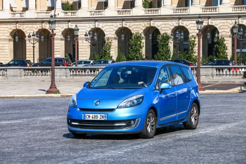 paris, france - september 15,2019  compact mpv renault grand scenic in a city street