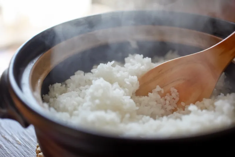 hot cooked rice with steam rising