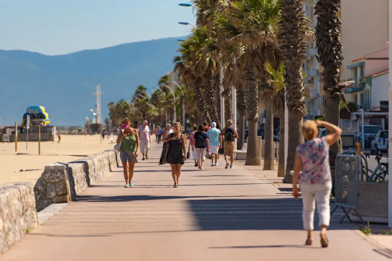 canet en roussillon, france  june 21, 2020  people walk on the maritime pass of the tourist town of canet en roussillion in france on the mediterranean sea