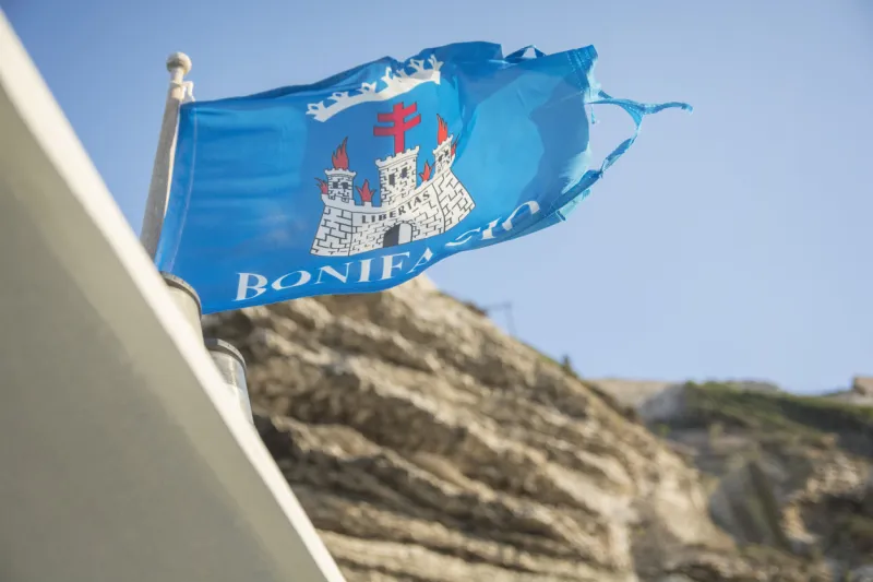 blue flag of bonifacio, a commune at the southern tip of the island of corsica, france