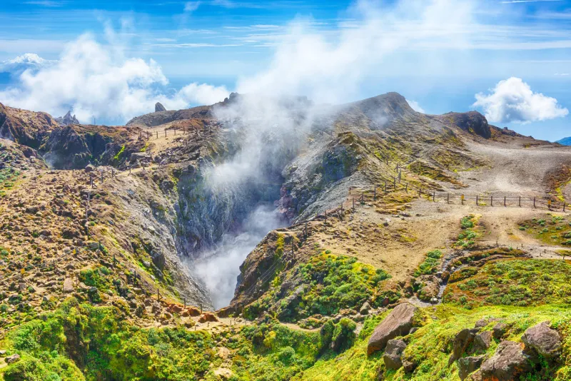 steam rising from the crater la soufriere volcano the highest mountain in guadeloupe, french department in caribbean
