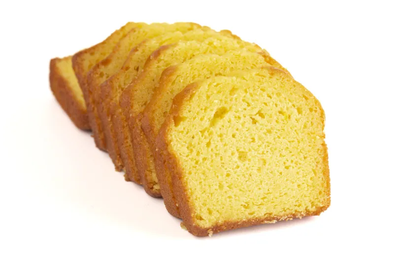 a sliced lemon cake isolated on a white background