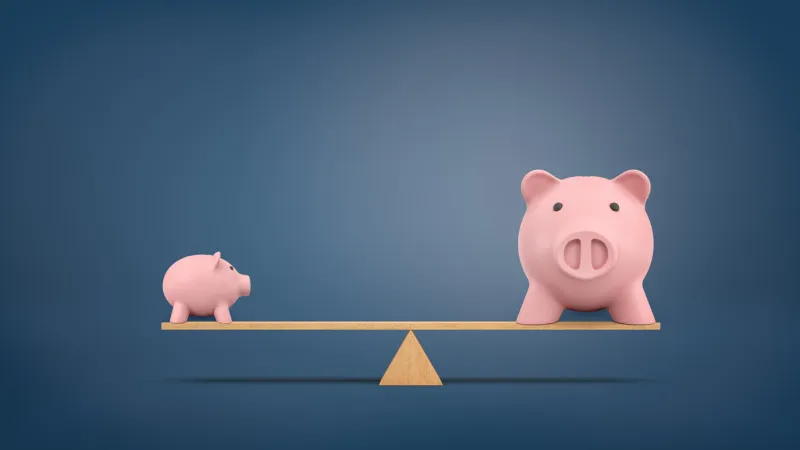 3d rendering of a small piggy bank in side view stands on a wooden seesaw balanced with a large piggy bank in front view less is more efficient saving investments growth